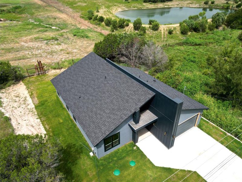 Front exterior of a new home in , Granbury, TX, highlighting curb appeal (Image 2). Front exterior of a new home in , Granbury, TX, highlighting curb appeal (Image 2).