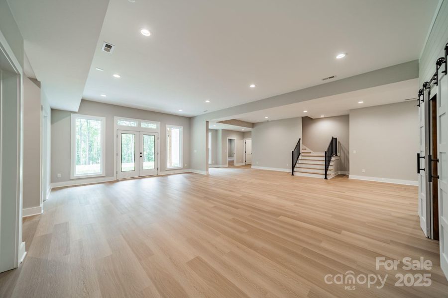 The Lower Level Living room is expansive and leads you to Lake Norman