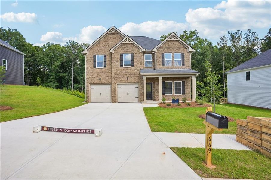 Front exterior of a new home in River Walk Farm, Covington, GA, highlighting curb appeal (Image 2). Front exterior of a new home in River Walk Farm, Covington, GA, highlighting curb appeal (Image 2).