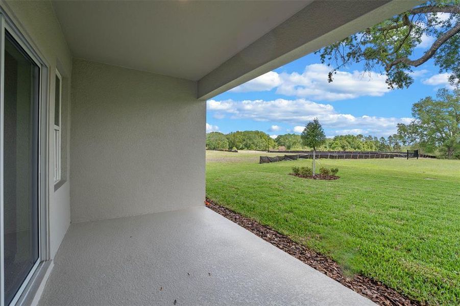 Exterior details and patio area of a home in Fountain View, Ormond Beach (Image 2).