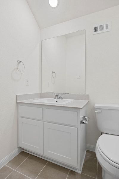 Bathroom in the Elm home plan by Trophy Signature Homes – REPRESENTATIVE PHOTO