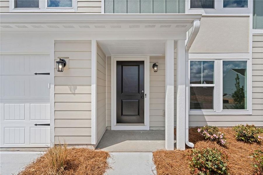 Exterior details and patio area of a home in Twin Lakes, Hoschton (Image 29).