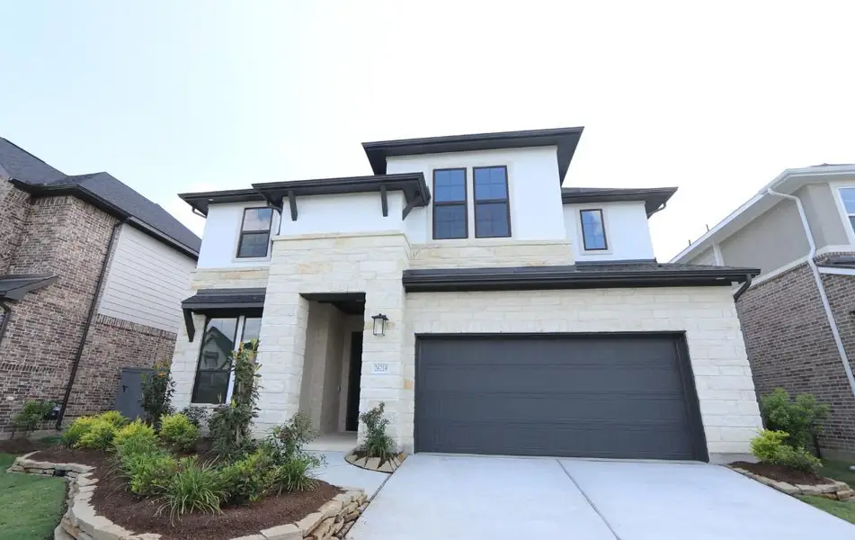 Front exterior of a new home in , Hockley, TX, highlighting curb appeal (Image 1). Front exterior of a new home in , Hockley, TX, highlighting curb appeal (Image 1).