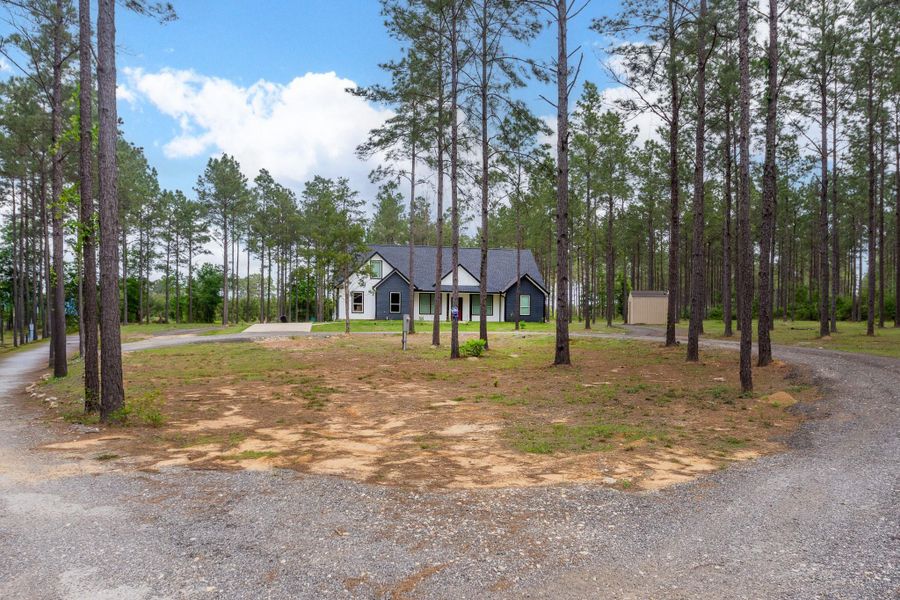 Front exterior of a new home in , Livingston, TX, highlighting curb appeal (Image 26).