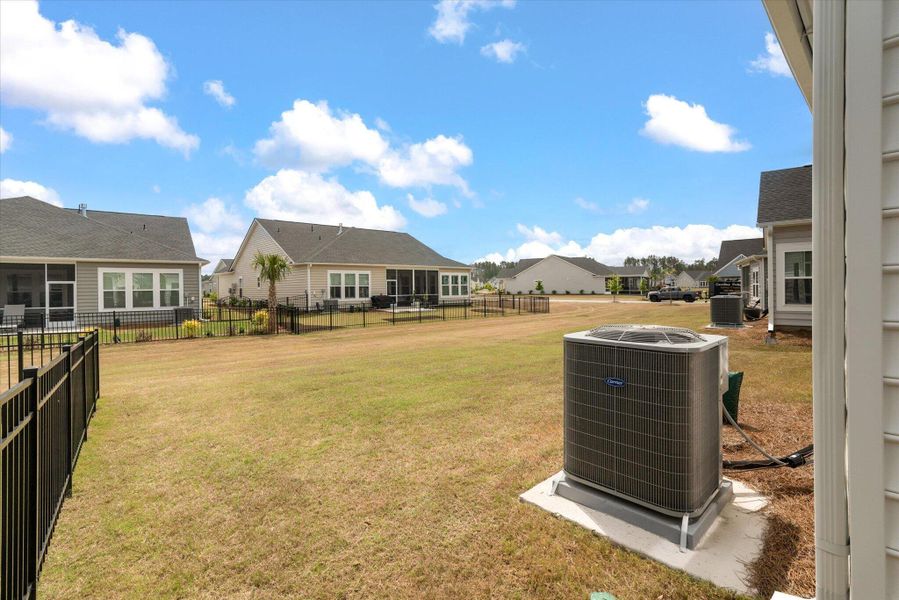 Exterior details and patio area of a home in Horizons at Summers Corner | 55+, Summerville (Image 25).