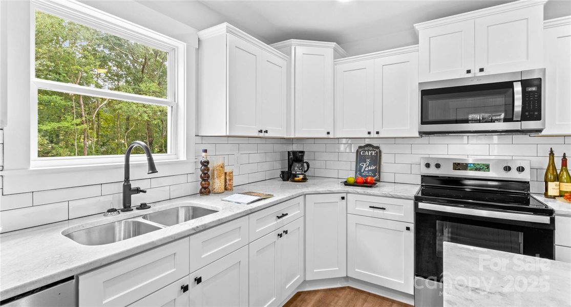 Stainless appliances include stove, dishwasher, microwave.