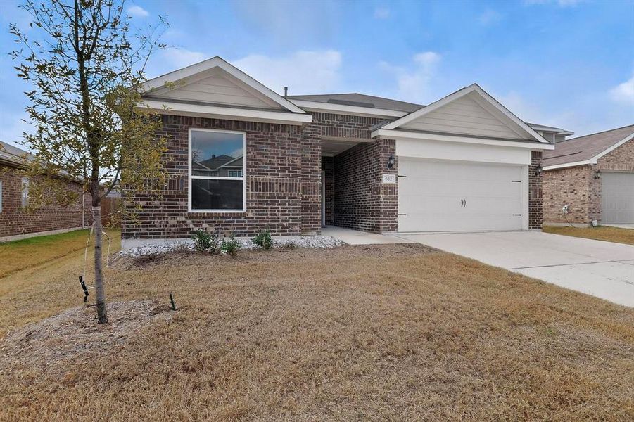 Front exterior of a new home in Patriot Estates, Venus, TX, highlighting curb appeal (Image 23).