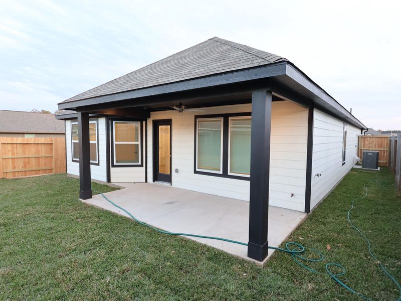 Exterior details and patio area of a home in Magnolia Ridge, Magnolia (Image 2). Exterior details and patio area of a home in Magnolia Ridge, Magnolia (Image 2).