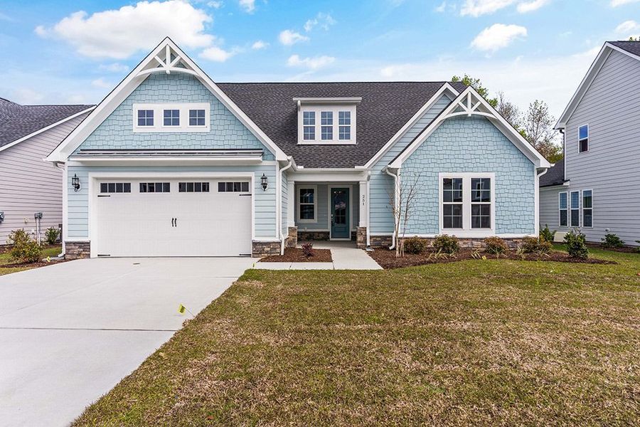 Representative exterior photo of a completed home built from the The Bradley by RobuckHomes in Windwater, Hampstead, NC (Image 26).