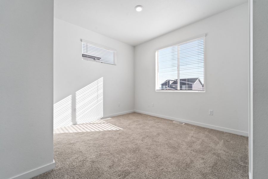 Front exterior of a new home in Liberty Draw, Evans, CO, highlighting curb appeal (Image 12). Front exterior of a new home in Liberty Draw, Evans, CO, highlighting curb appeal (Image 12).