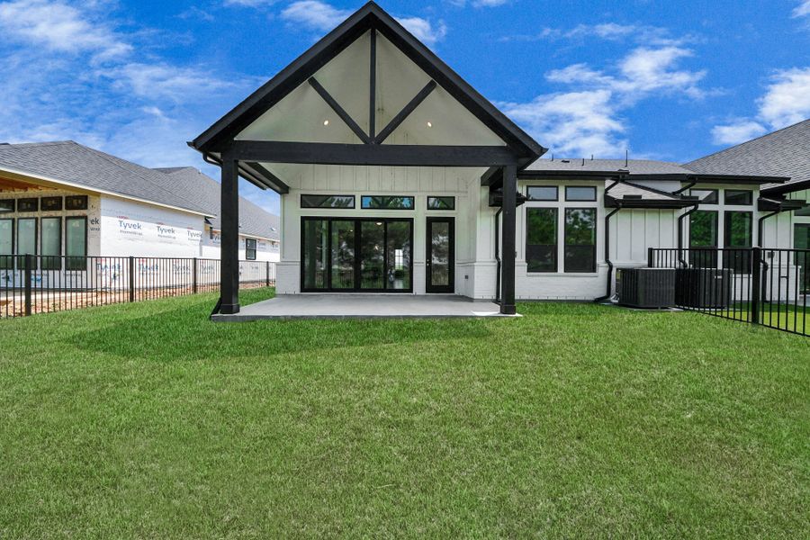 Exterior details and patio area of a home in Bridgeland, Cypress (Image 26).