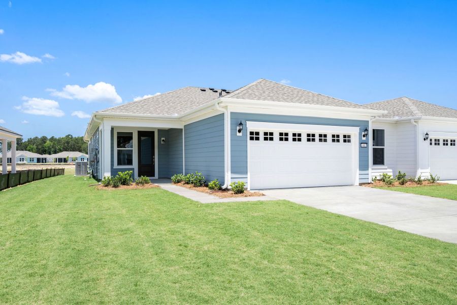 Front exterior of a new home in Sun City Hilton Head, Bluffton, SC, highlighting curb appeal (Image 20). Front exterior of a new home in Sun City Hilton Head, Bluffton, SC, highlighting curb appeal (Image 20).