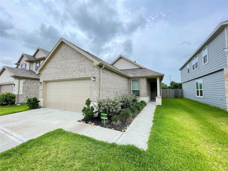 Front exterior of a new home in Olympia Falls, Fresno, TX, highlighting curb appeal (Image 21). Front exterior of a new home in Olympia Falls, Fresno, TX, highlighting curb appeal (Image 21).