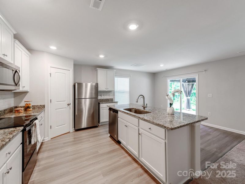 Furnished interior view inside a new home in McKee Creek Village, Charlotte (Image 8). Furnished interior view inside a new home in McKee Creek Village, Charlotte (Image 8).