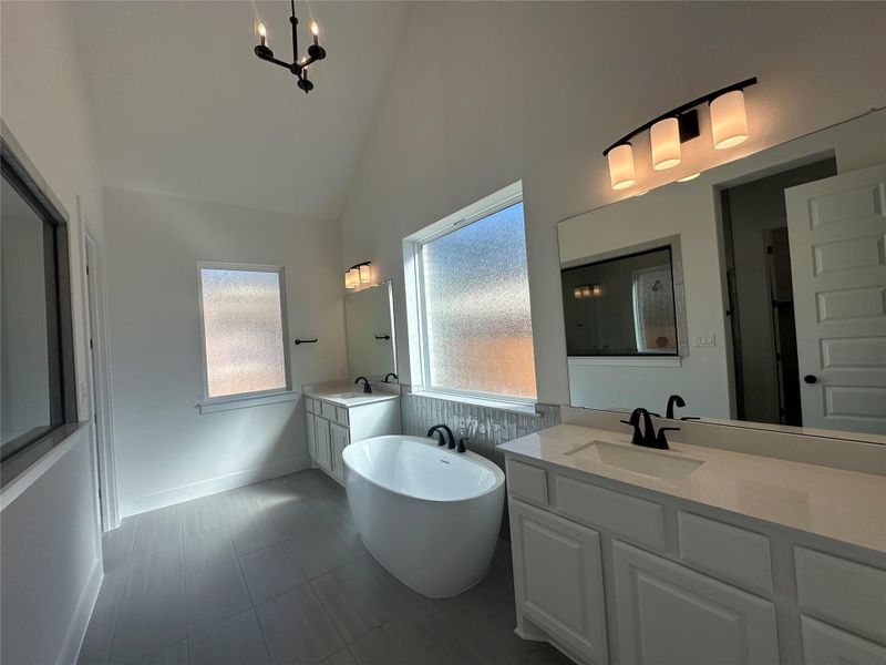Primary Bath retreat with dual vanities & soaking tub - Representative Photo