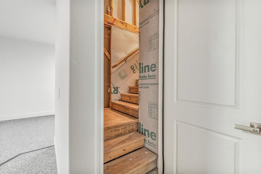 Hiding up the stairs in the garage is unfinished storage. Hiding up the stairs in the garage is unfinished storage.
