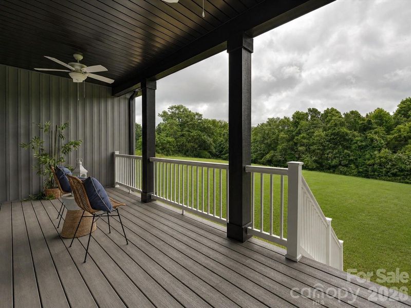 Concept Grass - Relax and unwind on the covered back porch overlooking peaceful green space and scenic tree-lined views.