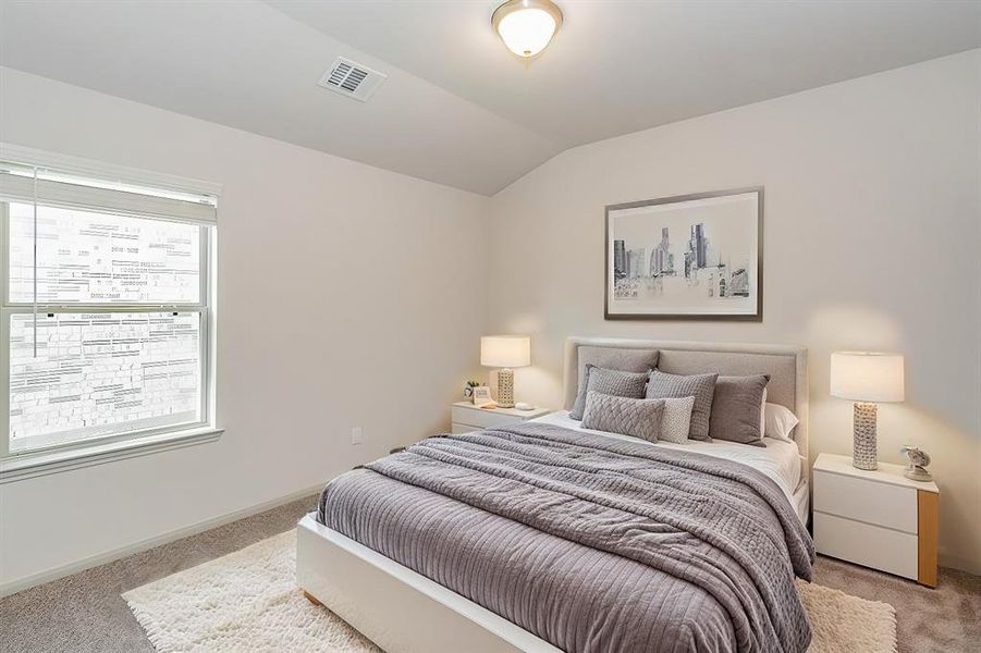 This bright and cozy bedroom offers a peaceful retreat with plush carpeting and a large window that brings in natural light. The neutral palette and spacious layout provide the perfect blank canvas for personalization. Whether used as a guest room, office, or kids' room, this space promises comfort and versatility.