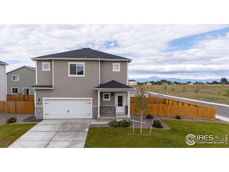 Front exterior of a new home in Hidden Creek, Frederick, CO, highlighting curb appeal (Image 1).