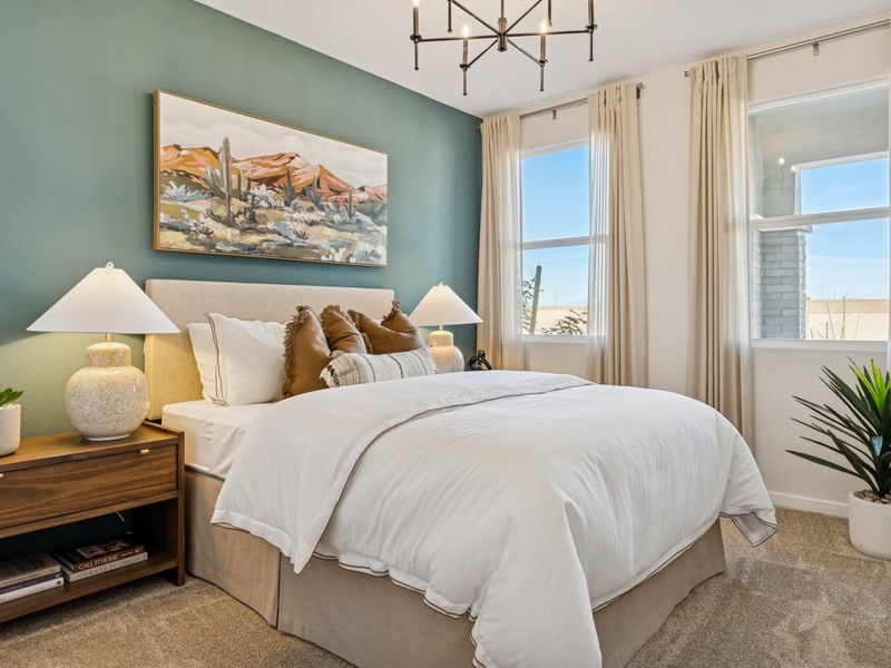 A bedroom with a large bed. A bedroom with a large bed.