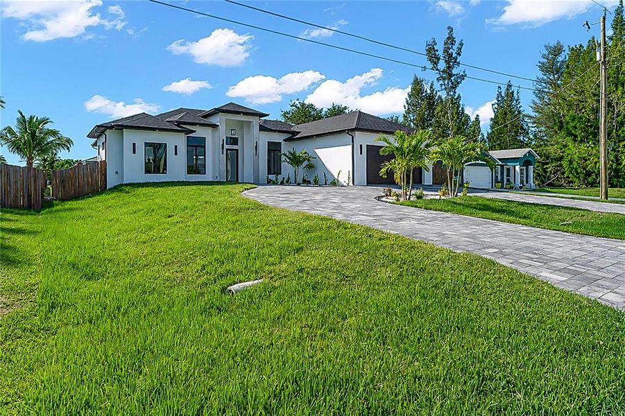 Front exterior of a new home in , Cape Coral, FL, highlighting curb appeal (Image 30).