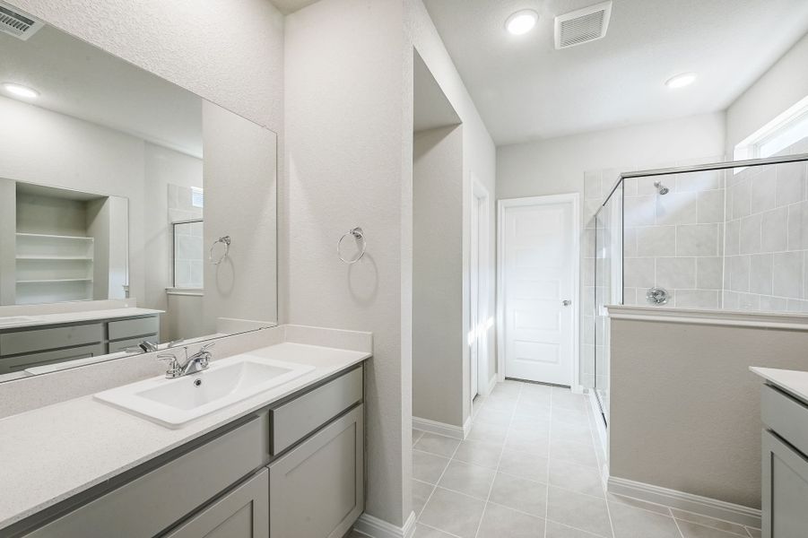 Primary Bath in the Willow home plan by Trophy Signature Homes – REPRESENTATIVE PHOTO Primary Bath in the Willow home plan by Trophy Signature Homes – REPRESENTATIVE PHOTO