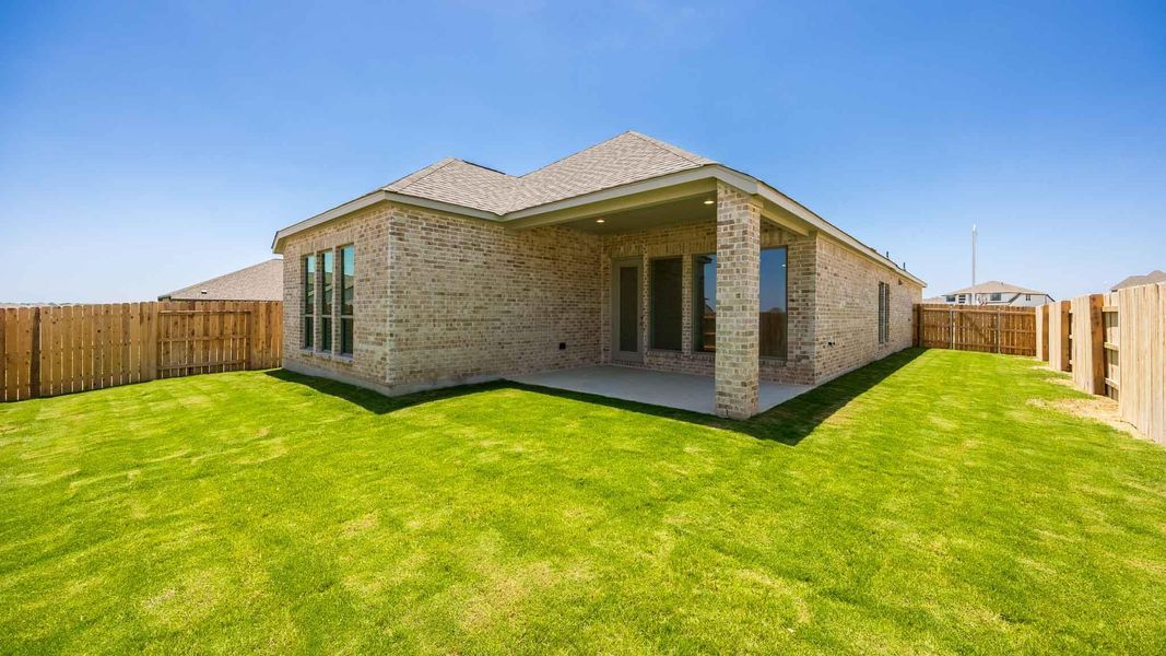 Exterior details and patio area of a home in Lariat 45', Liberty Hill (Image 3).