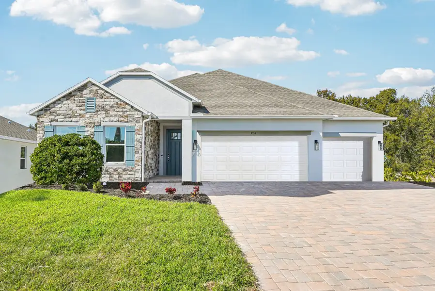 Front exterior of a new home in Royal Highlands, Weeki Wachee, FL, highlighting curb appeal (Image 1). Front exterior of a new home in Royal Highlands, Weeki Wachee, FL, highlighting curb appeal (Image 1).