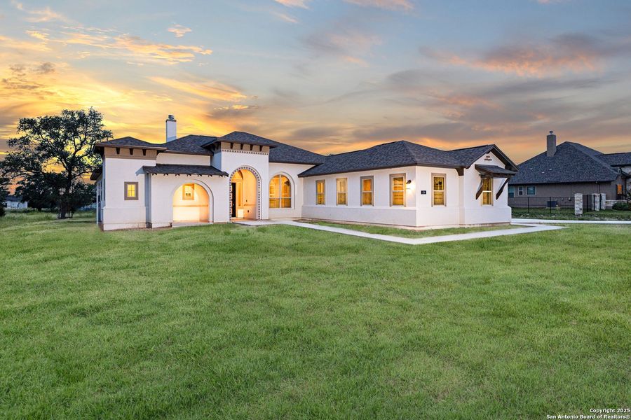 Front exterior of a new home in Potranco Acres, Castroville, TX, highlighting curb appeal (Image 24). Front exterior of a new home in Potranco Acres, Castroville, TX, highlighting curb appeal (Image 24).