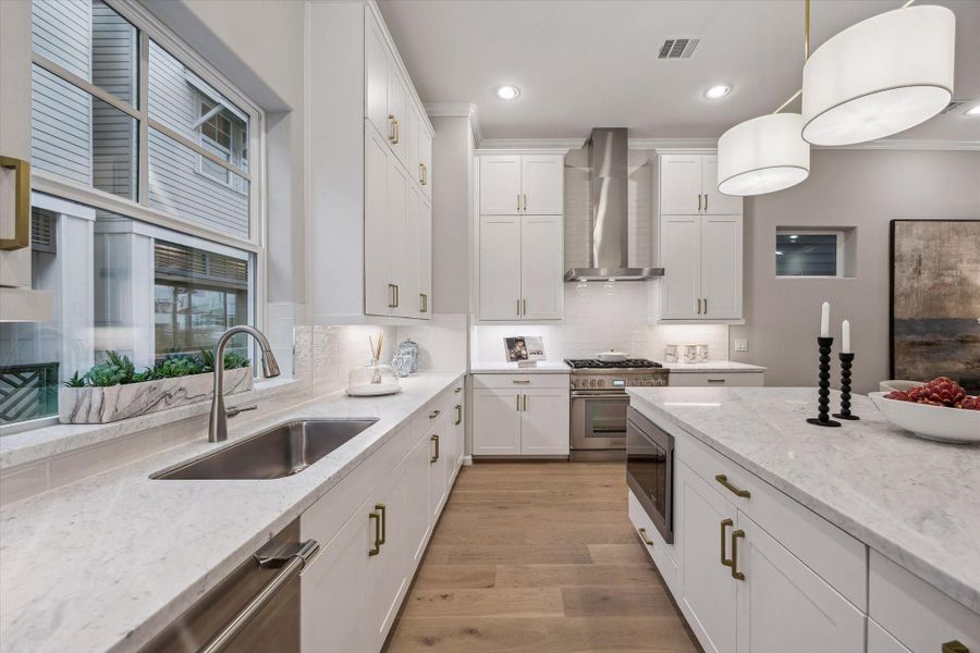 Custom cabinetry and ample workspace.