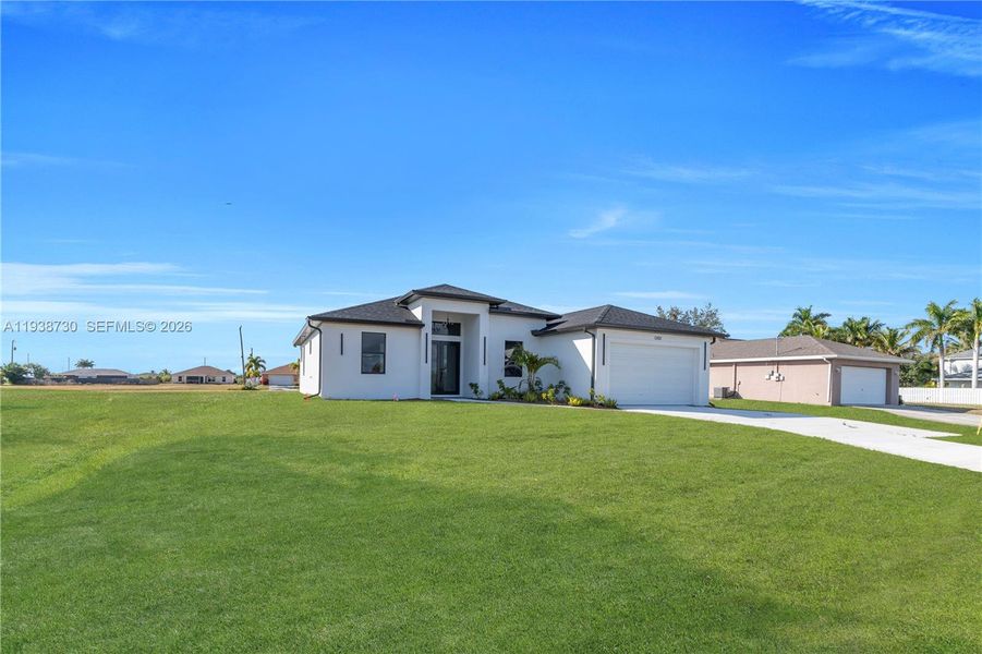 Front exterior of a new home in , Cape Coral, FL, highlighting curb appeal (Image 26).