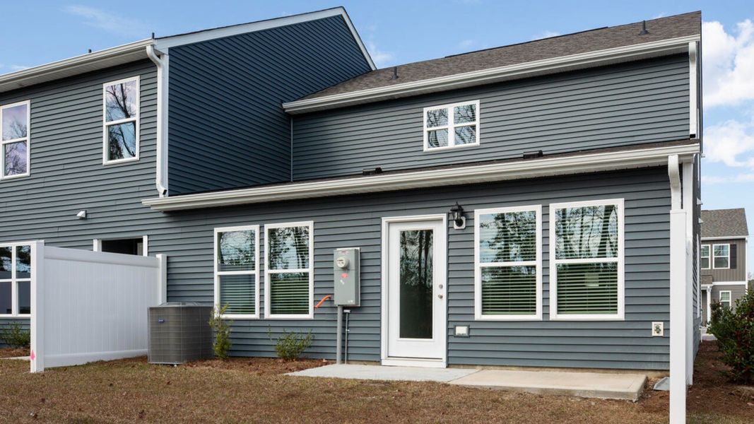 Exterior details and patio area of a home in Waterside Townhomes, Surf City (Image 3).