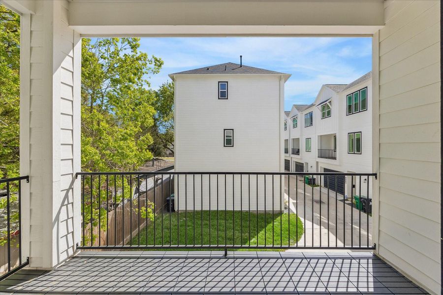 Expansive balcony seamlessly extending from the living room, offering serene views of lush trees and the charming community Chateaus. This inviting outdoor space provides the perfect setting for relaxing, entertaining, or simply enjoying the picturesque surroundings. Expansive balcony seamlessly extending from the living room, offering serene views of lush trees and the charming community Chateaus. This inviting outdoor space provides the perfect setting for relaxing, entertaining, or simply enjoying the picturesque surroundings.