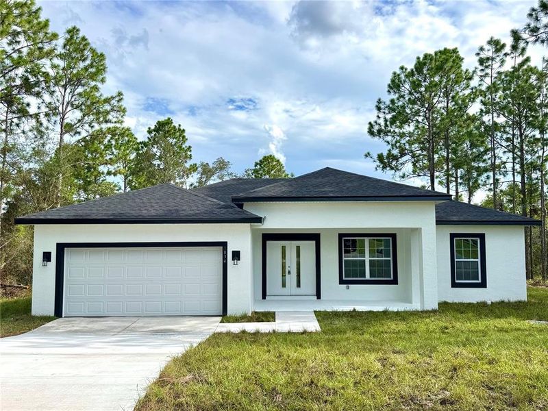 Front exterior of a new home in , Citrus Springs, FL, highlighting curb appeal (Image 2).