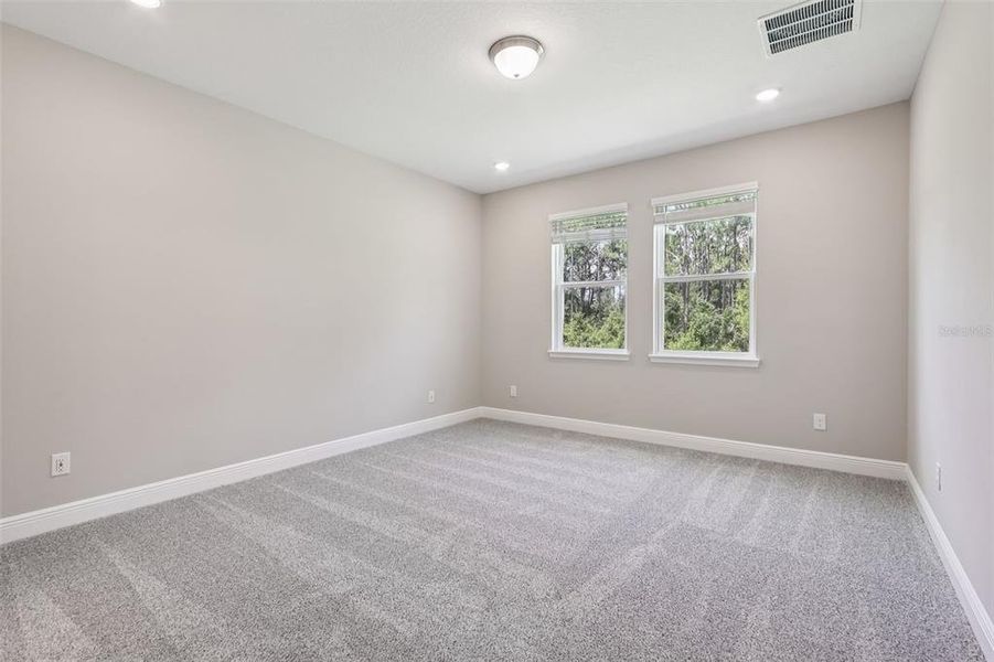 Spacious, unfurnished interior of a new home in Legends Preserve - Signature Series, Daytona Beach (Image 33).