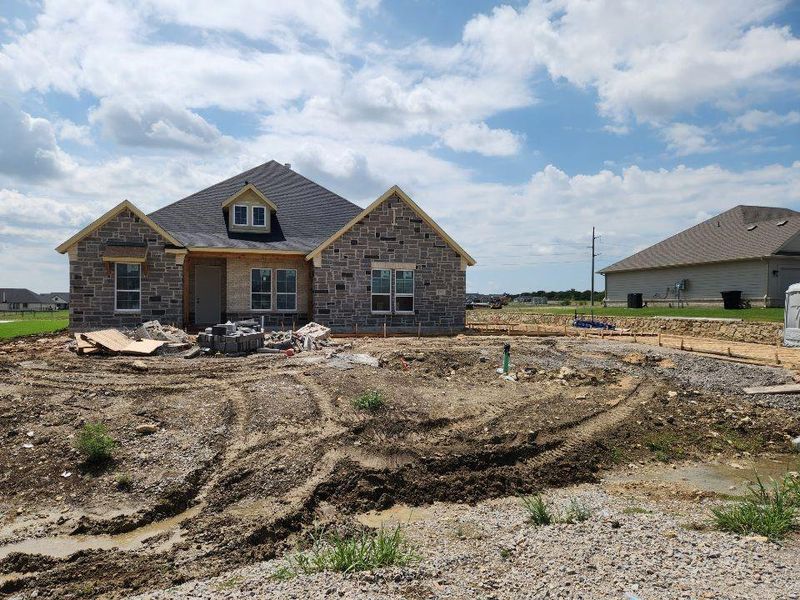Front exterior of a new home in Fairview Meadows, New Fairview, TX, highlighting curb appeal (Image 1). Front exterior of a new home in Fairview Meadows, New Fairview, TX, highlighting curb appeal (Image 1).