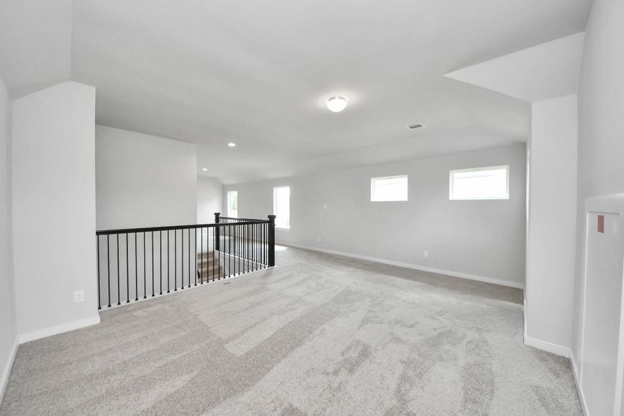 Ascend to relaxation in this fantastic game room! Ideal for both casual gatherings and adult gaming, it boasts plush carpet, lofty ceilings, custom paint, and ample windows for abundant natural light Ascend to relaxation in this fantastic game room! Ideal for both casual gatherings and adult gaming, it boasts plush carpet, lofty ceilings, custom paint, and ample windows for abundant natural light