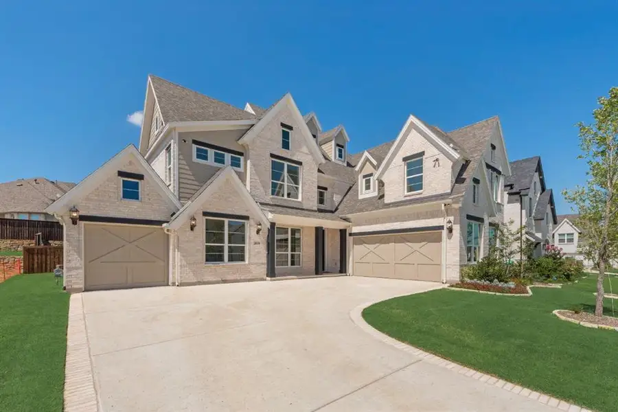 Front exterior of a new home in Wellspring Estates, Celina, TX, highlighting curb appeal (Image 1). Front exterior of a new home in Wellspring Estates, Celina, TX, highlighting curb appeal (Image 1).