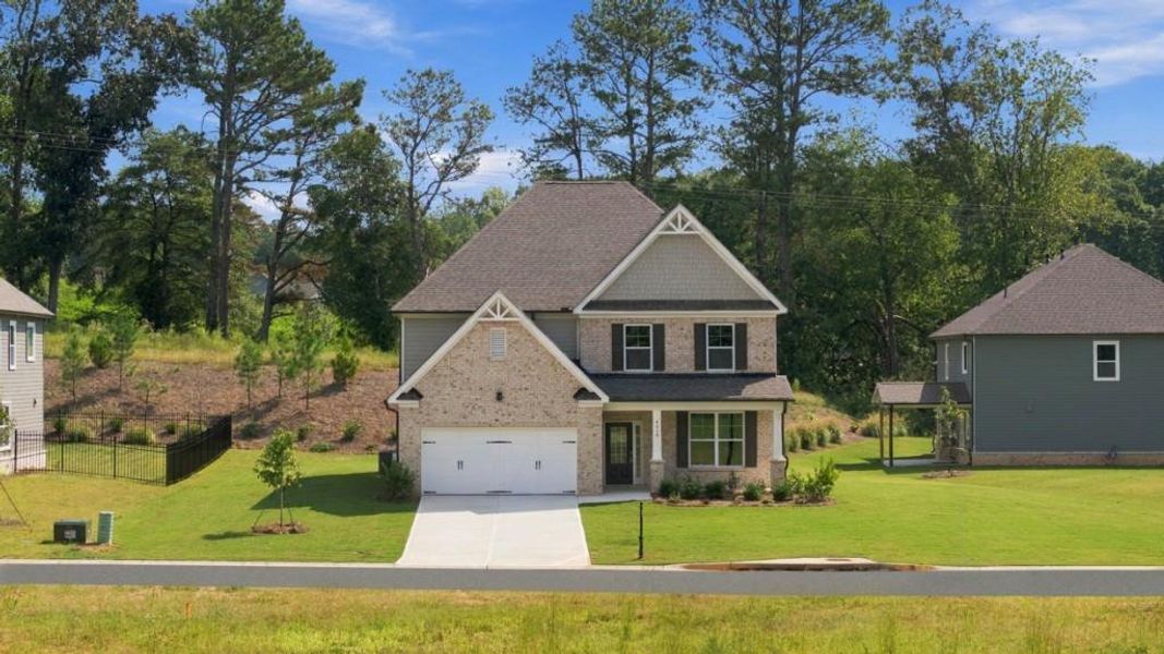 Front exterior of a new home in Haven Abbey, Cumming, GA, highlighting curb appeal (Image 2).