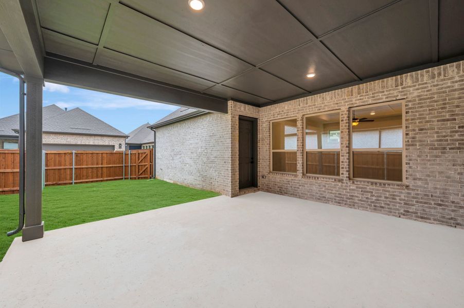 Exterior details and patio area of a home in Elements at Viridian - Traditional Series, Arlington (Image 4).