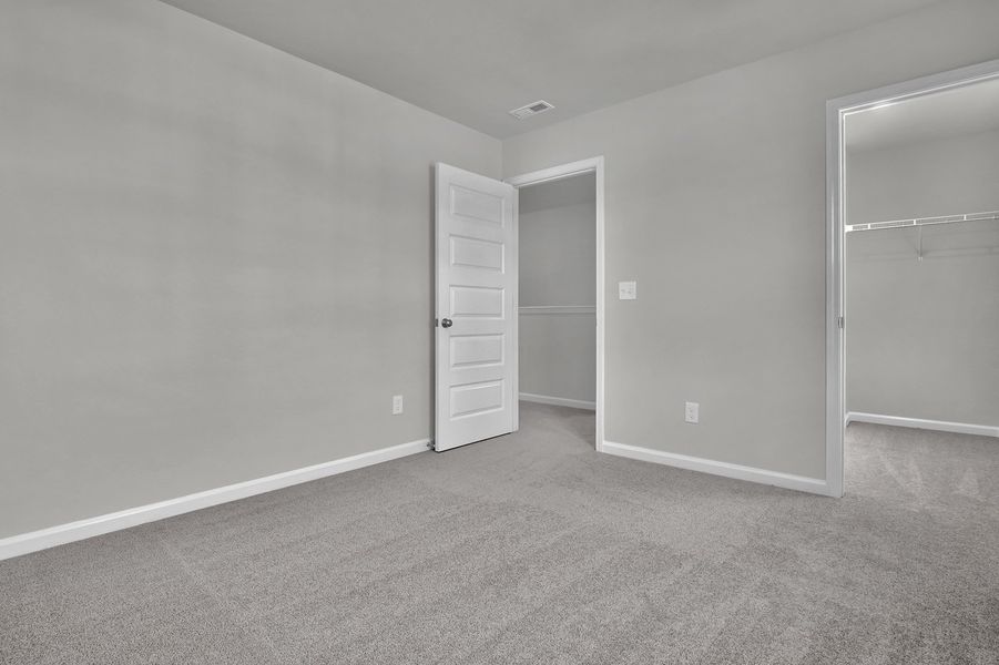 Spacious, unfurnished interior of a new home in Grand Park, Leland (Image 25). Spacious, unfurnished interior of a new home in Grand Park, Leland (Image 25).