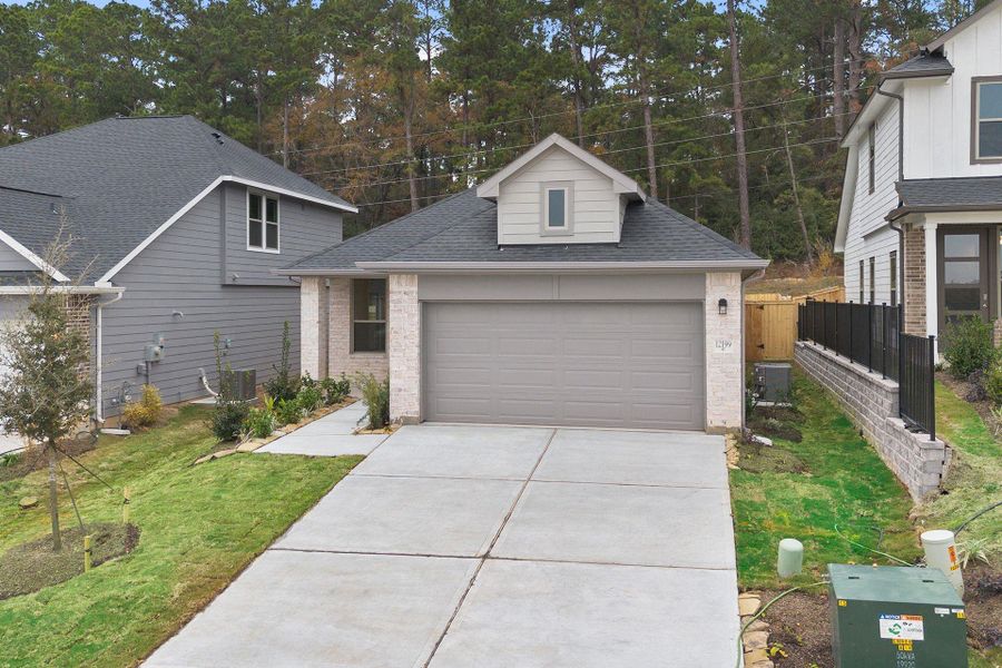 Front exterior of a new home in Westridge Cove 40', Panorama Village, TX, highlighting curb appeal (Image 20).