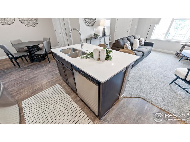 Kitchen, Dining area and Great Room - photos not of actual unit - finishes may vary Kitchen, Dining area and Great Room - photos not of actual unit - finishes may vary