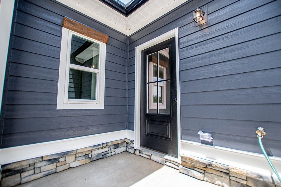 Exterior details and patio area of a home in WOODMONT RESERVE, Roopville (Image 39).