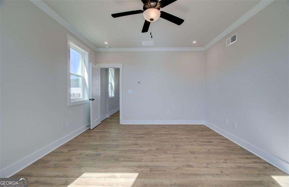 Spacious, unfurnished interior of a new home in The Paddocks at Doc Hughes, Buford (Image 49).