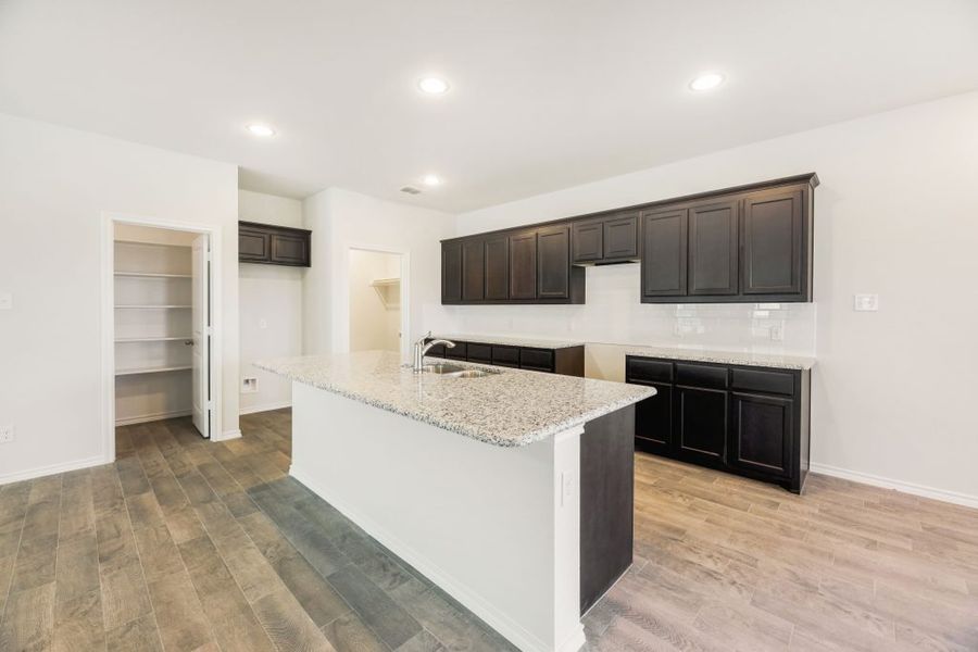 Representative exterior photo of a completed home built from the Lockhart by Impression Homes in Heartland, Heartland, TX (Image 8). Representative exterior photo of a completed home built from the Lockhart by Impression Homes in Heartland, Heartland, TX (Image 8).