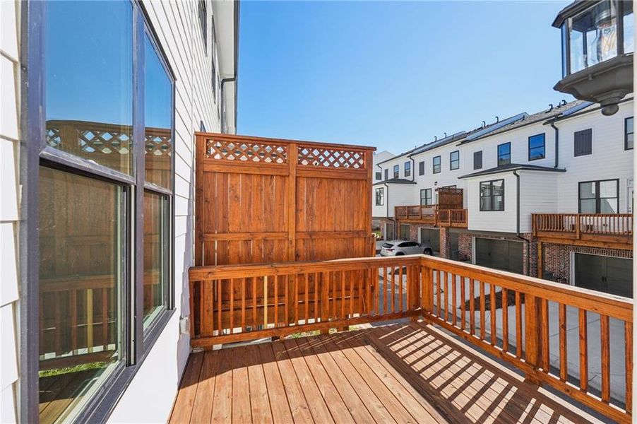 Exterior details and patio area of a home in Palisades Townhomes, Cumming (Image 3).