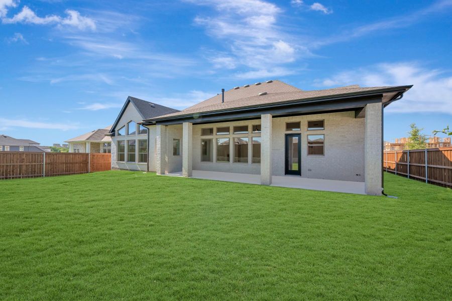 Exterior details and patio area of a home in Monterra - Classics, Fate (Image 4).