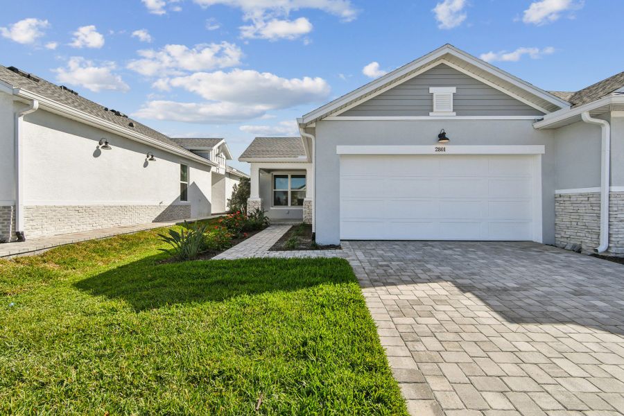 Representative exterior photo of a completed home built from the The Searidge by David Weekley Homes in Gracewater at Sarasota, Sarasota, FL (Image 1). Representative exterior photo of a completed home built from the The Searidge by David Weekley Homes in Gracewater at Sarasota, Sarasota, FL (Image 1).