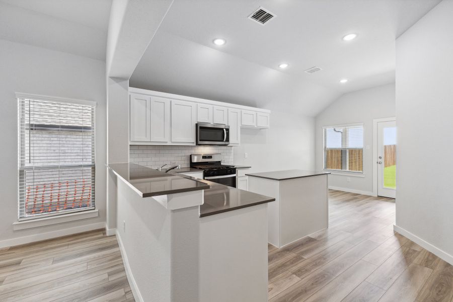 Kitchen in the Amber home plan by Trophy Signature Homes – REPRESENTATIVE PHOTO